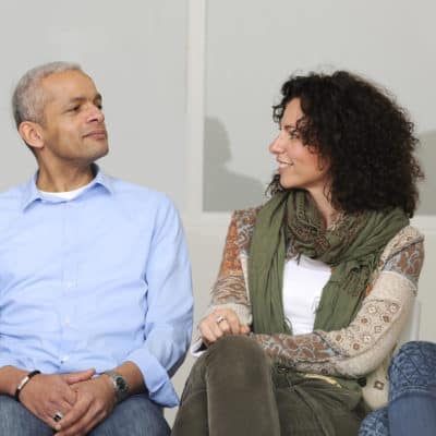 Photo of a couple in therapy smiling at each other
