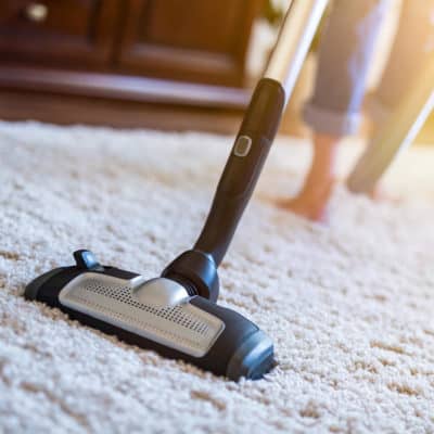 Photo of a vacuum being used on a rug