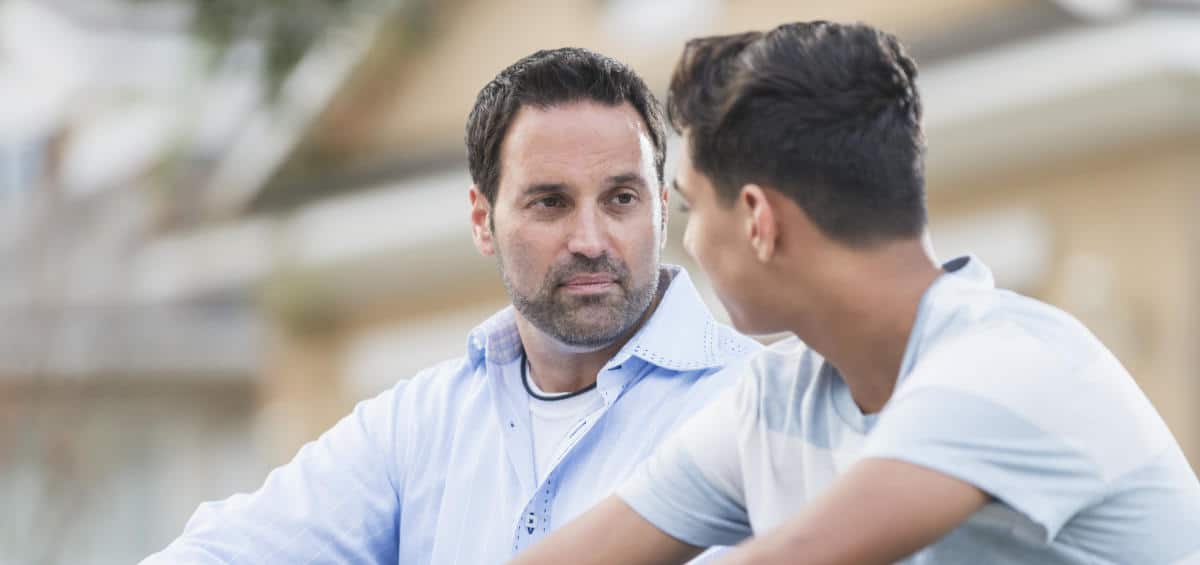 Photo of a man mentoring a young man