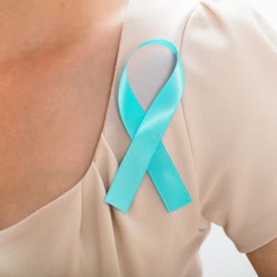 Photo of a blue ribbon on a woman's blouse