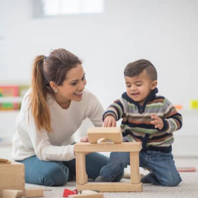 Photo of a young boy playing with blocks