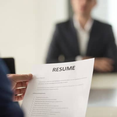 Photo of someone holding a resume