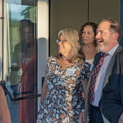 Group of people walking through a doorway