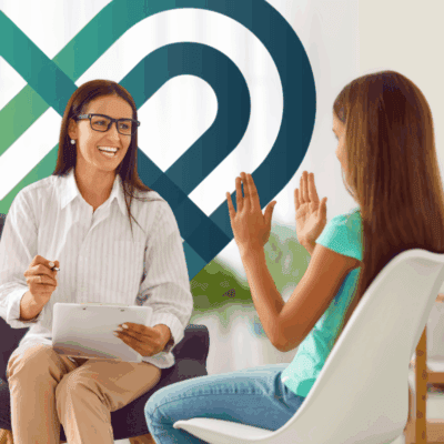 Adult Mental Health First Aid instructor supports a young person during a youth mental health conversation, representing Youth Mental Health First Aid training focused on suicide prevention and early intervention.