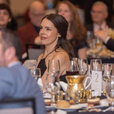 Board Chair Alexandra Normington sits among guests listening during the All In for PCH Gala program.