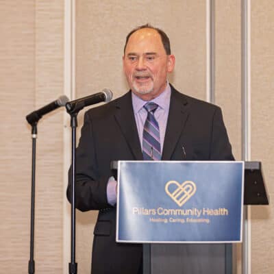 Don Bestvina speaks at the podium during the All In for PCH Gala.