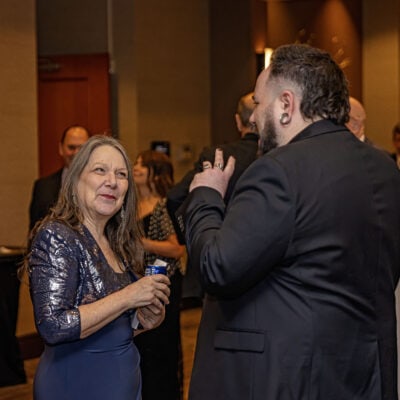 Lisa Knasiak smiles while talking with Joe Erbentraut during the reception at the All In for PCH Gala.