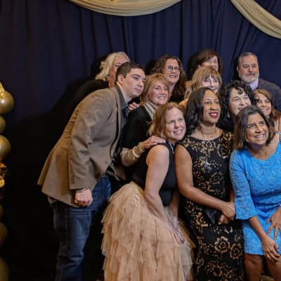 Pillars Community Health staff members gather together for a group photo during the All In for PCH Gala.