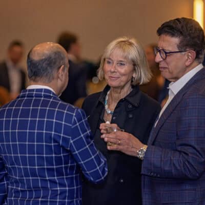 Rita Girgis and Sam Girgis speak with another guest during the reception at the All In for PCH Gala.