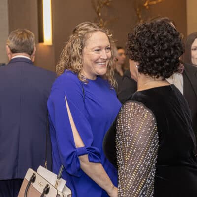 Shelly Lustrup of NAMI Metro Suburban speaks with Angela Curran during the All In for PCH Gala reception.