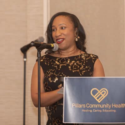 Lanita Higgs Jackson speaks at the podium during the All In for PCH Gala.