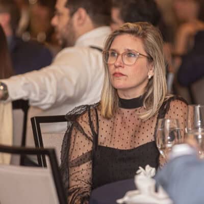 Guests seated at banquet tables listen to speakers during the program at the All In for PCH Gala.