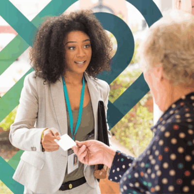 A Pillars Community Health behavioral health professional speaks with a community member, representing Mobile Crisis Response and community-based mental health support.